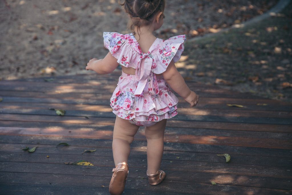 Pink floral romper with matching headband - West & Rose