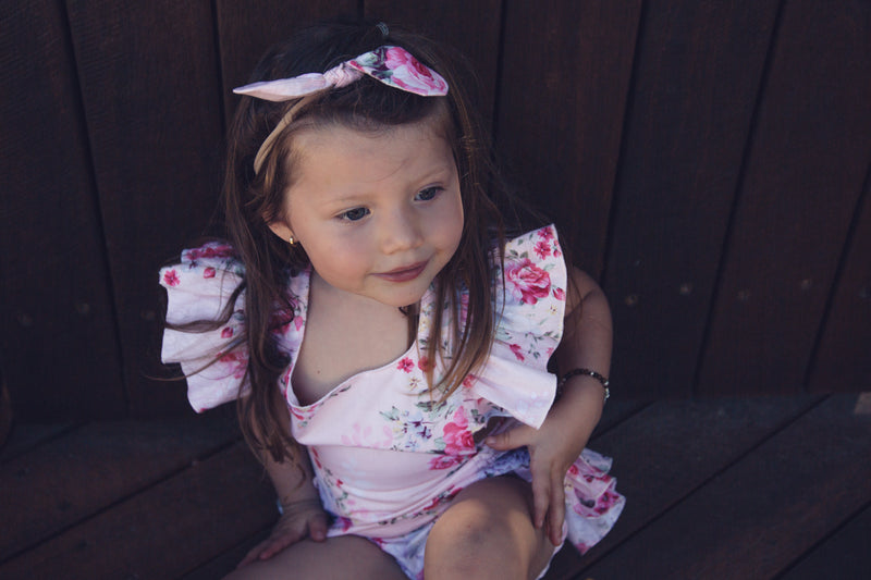 Pink floral romper with matching headband - West & Rose